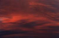 deep red sunset on alto stratus