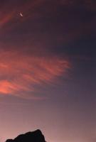 sunset over Devil's Peak with new moon
