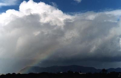 rainbow from cumulonimbus cloud over Muizenberg Mountain