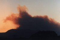plume of smoke above Hout Bay at Sunset
