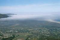fog layer over Kommetjie from Noordhoek mountain