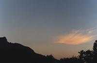 sunrise on solitary cirrus in front of Devil's Peak