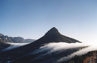 fog rolling over Kloof Nek past Lion's Head